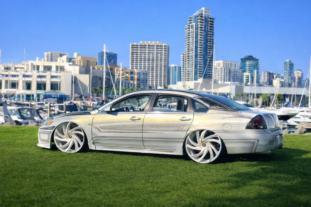 Iridescent sedan by the marina.webp